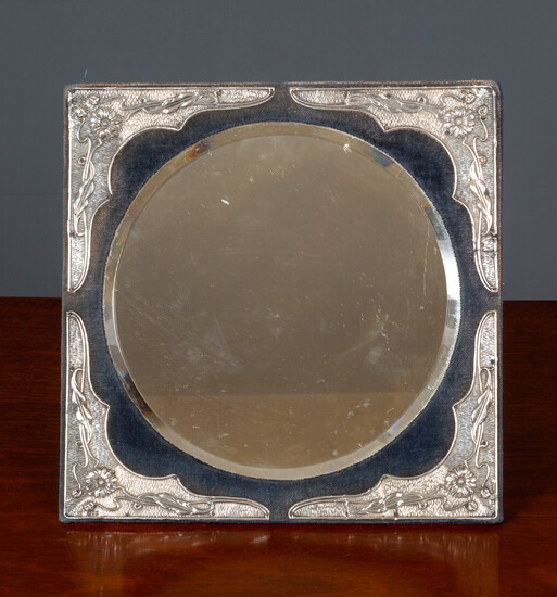 An Edwardian silver mounted dressing table mirror