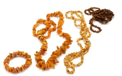 SOLD. An amber collection of partly polished and unpolished amber and milky amber and an elastic bracelet. L. app. 86-142 cm. – Bruun Rasmussen Auctioneers of Fine Art
