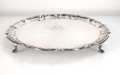 An early 20th century silver salver of circular form on...