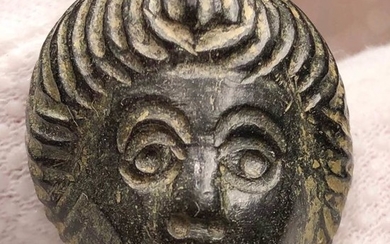 Ancient Roman Bronze Impressive Decorative Mask of Youth with an interesting Hairstyle.