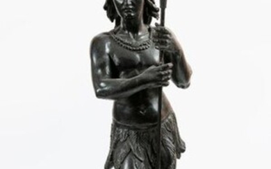 Blackened wooden sculpture representing an Indian warrior with feet holding a spear. Work from the 19th century