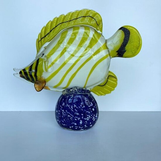 Blown glass fish on a pedestal
