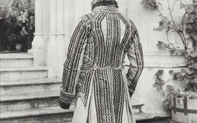 British School, early-mid 20th century- Man standing full-length wearing an embroidered house coat; gelatin silver print, 37x28cm Provenance: Property of Future PLC, removed from the offices of Country Life magazine.