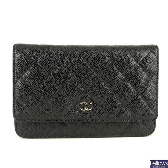 CHANEL - a black leather WOC 'Wallet On Chain' handbag.