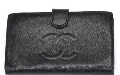 NOT SOLD. Chanel: A wallet made of black Caviar leather with gold toned hardware, a...