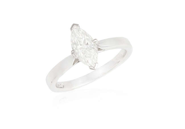 Description A DIAMOND SINGLE-STONE RING The marquise-shaped diamond weighing...