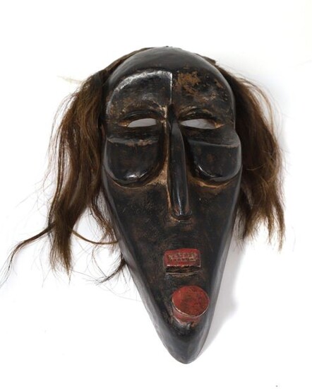 False Mask" mask made of wood with black patina and red pigment, hair made of horsehair.
