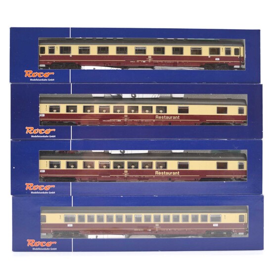 Four Roco HO model railway passenger coaches.