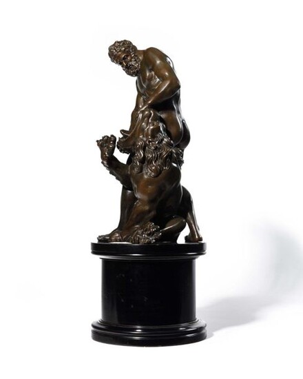 French School of the late 17th century, early 18th century Hercules and the Lion of Nemea Bronze with brown patina shaded with green H. 40 cm rests on a blackened and molded wooden base H. 19 cm Small accidents Another copy of this group is kept at...