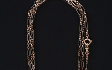 Gold link chain with gold pendant.