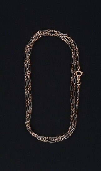 Gold link chain with gold pendant.