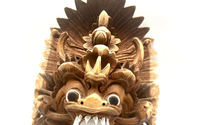 HEAVENLY CARVINGS: WOODEN DRAGON MASK THAT REFLECTS THE CULTURAL ESSENCE OF BARONG NAGA.