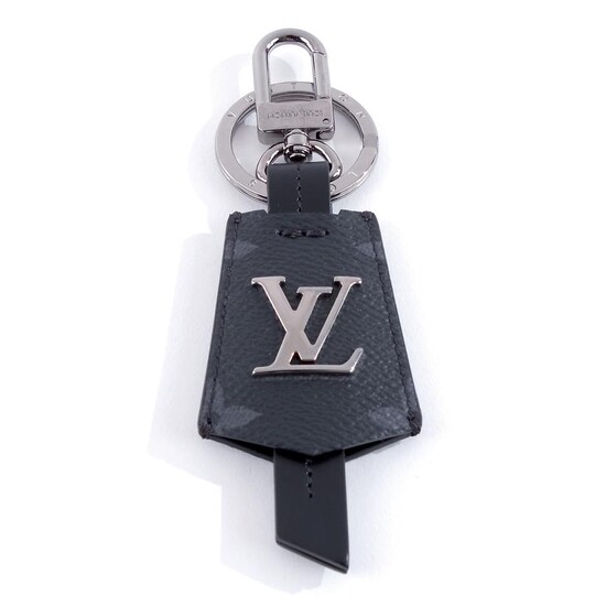 Louis Vuitton, a bag charm and a canvas, brass and calfskin key holder