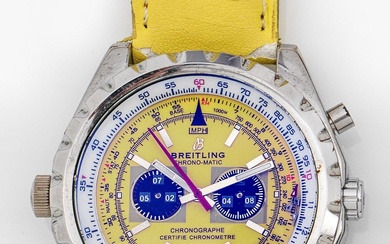 Montre-bracelet pour homme de Breitling-"Chrono-Matic 1884" en acier. Lunette tournante, cadran jaune avec index bâtons...