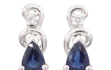 Pair of 14ct white gold pear cut sapphire and diamond stud earrings