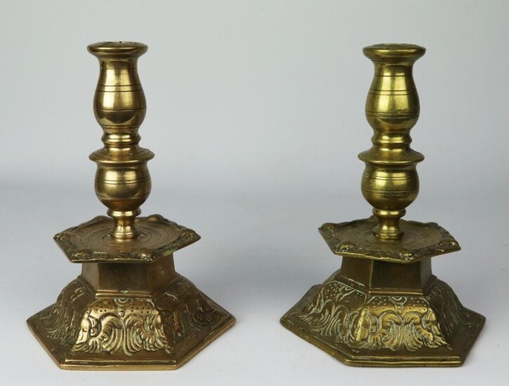 Pair of candleholders in cast and chased brass, alternating base of rinceaux