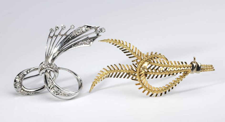 Pair of gold and diamond brooches. white and yellow gol...