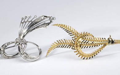 Pair of gold and diamond brooches. white and yellow gold...
