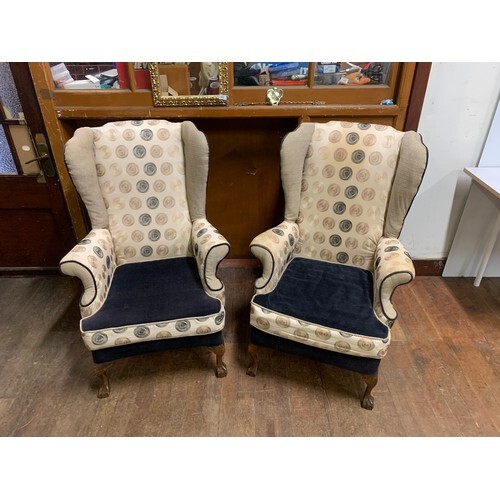 Pair of vintage wing back chairs with modern upholstery.
