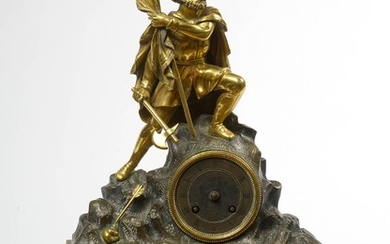 Pendule Restauration en bronze à patine brune et dorée surmontée d'une "Homme à l'étendard'. Epoque:...