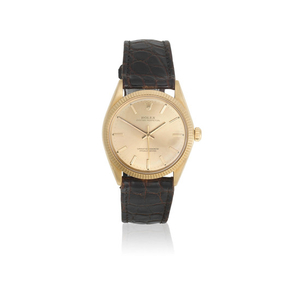 Rolex. An 18K gold automatic wristwatch