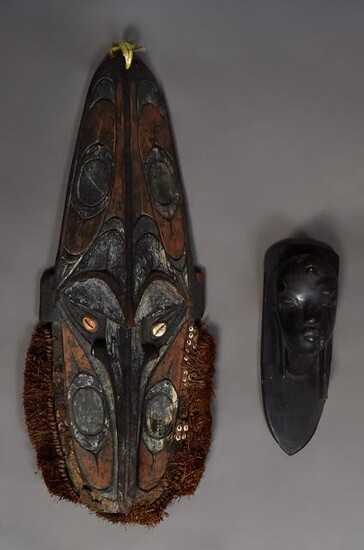 Two African Carved Figures, 20th c., one a tall mask