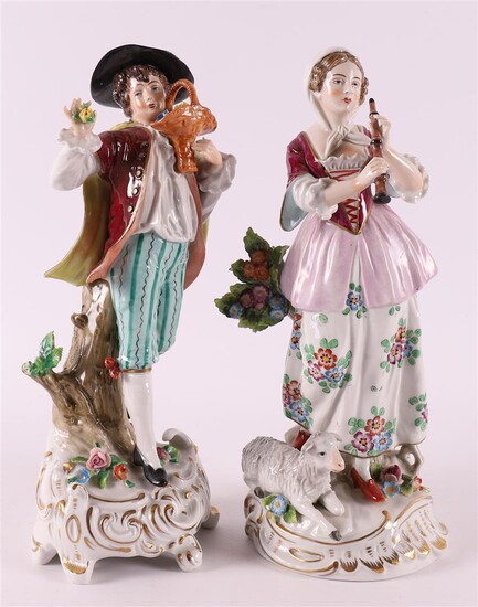 (-), Two polychrome porcelain figures including a woman...