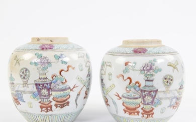 Two porcelain jars, decorated in famille rose enamels with prcious objects and auspicious symbols. Marked with double blue circsle. China, late 19th century