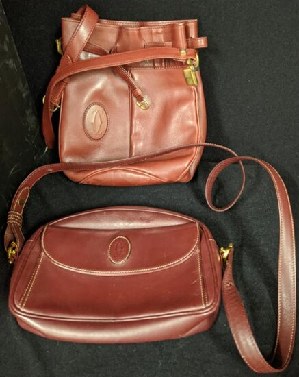 Two vintage Cartier handbags