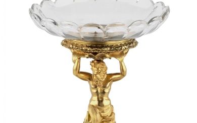 Un elegant vase à fruits, en bronze dore et verre cristal en forme de Triton...