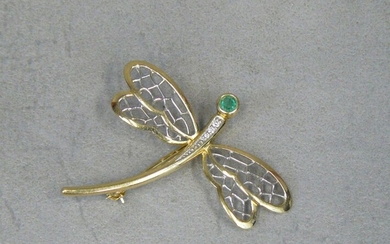 A gold dragonfly (eagle) brooch with a green stone and...
