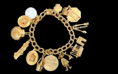 14K Yellow Gold Charm Bracelet with 16 Suspended Charms.