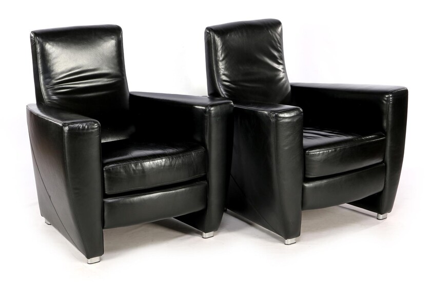 (-), 2 black leather armchairs of the brand...