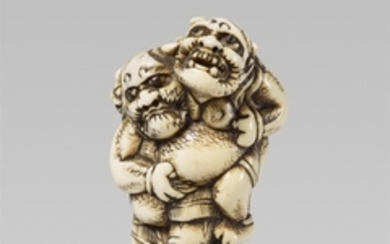 A good and amusing ivory netsuke of two wrest ...