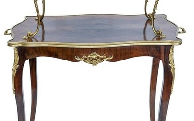 A Louis XV style gilt bronze and kingwood table a the