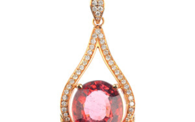 A tourmaline and diamond pendant. View more details