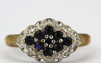 9CT, SAPPHIRE AND DIAMOND CLUSTER RING.