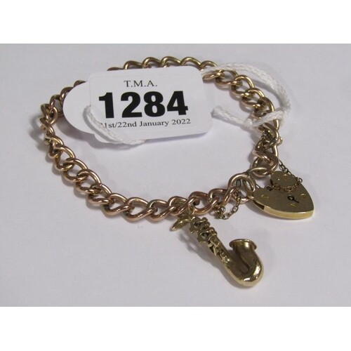 9ct GOLD LINK BRACELET WITH PADLOCK FASTENING AND SAXOPHONE ...
