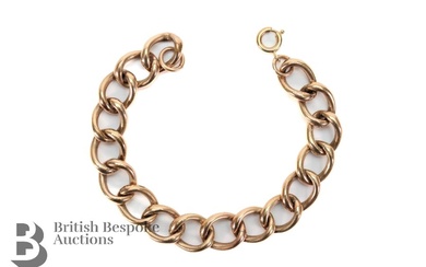 9ct rose gold curb-link bracelet (tested). The bracelet measures 165mm in length, approx 16.96 gms.