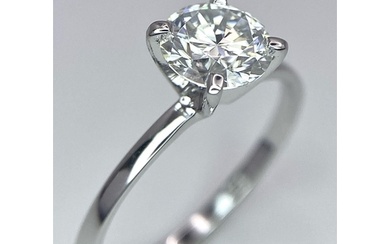 A 14 K white gold solitaire ring with a round cut, moissanit...