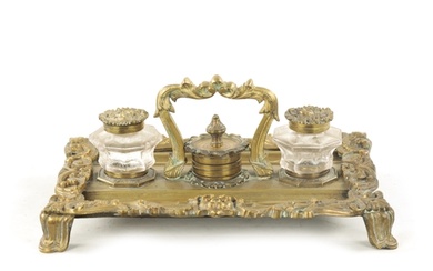 A 19TH CENTURY BRASS ROCOCO INK STAND with glass ink bottles...