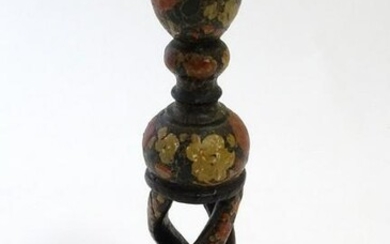 A 20thC Kashmiri candlestick with open twist column and