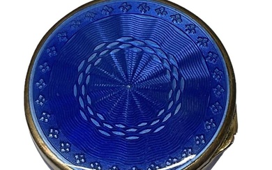 A 925 grade hallmarked silver blue enamelled compact, diameter 3.5cm.Condition...