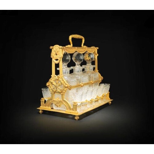 A BACCARAT CUT GLASS AND GILDED BRONZE TANTALUS AND LIQUEUR ...