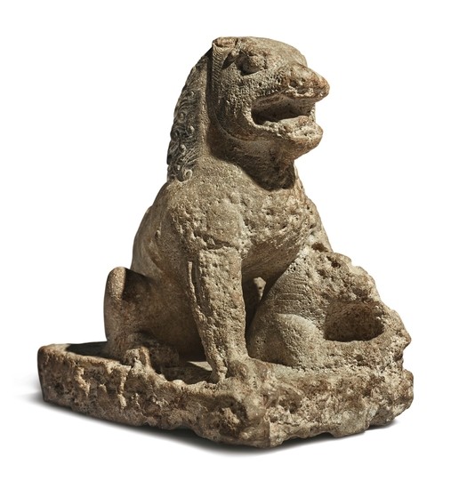 A CARVED LIMESTONE FIGURE OF A SEATED LION TANG DYNASTY