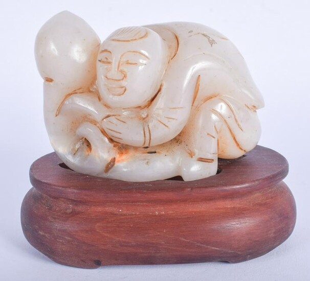 A CHINESE CARVED AGATE FIGURE OF A BOY 20th Century. 7