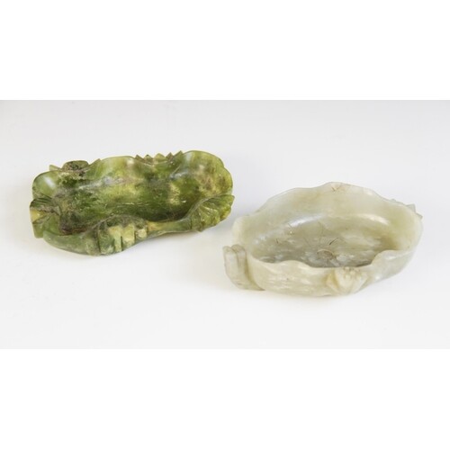 A Chinese carved Jade lotus dish, the pale green jade carved...