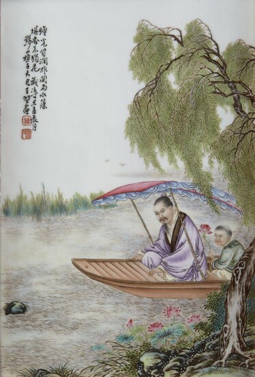 A Chinese porcelain rectangular plaque, 20th century, painted in famille rose enamels with a scholar accompanied by an attendant riding in a sampan cruising through a lake with blossoming lotus and overhanging willow trees in the foreground and...