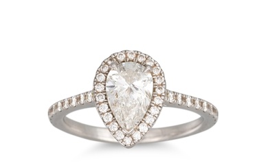 A DIAMOND HALO CLUSTER RING, the pear shaped diamond, to dia...