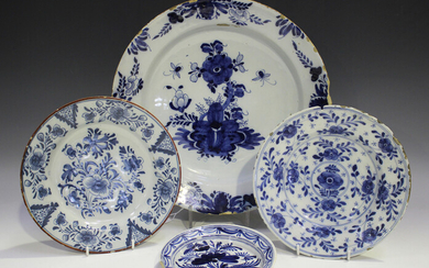 A Dutch Delft charger, early 18th century, blue painted with a central flower spray and insects with